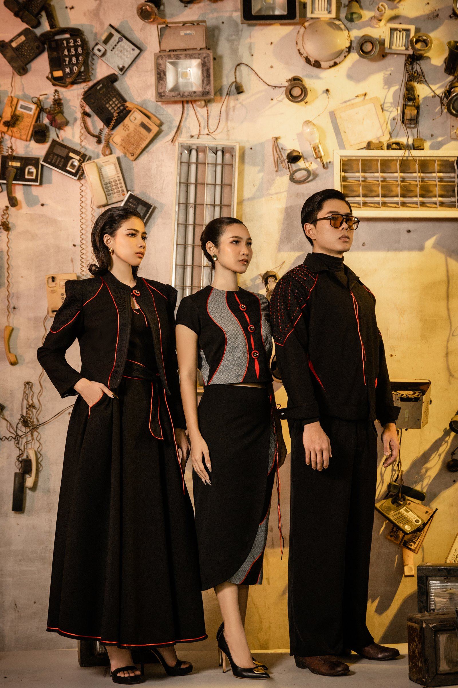 Three looks from Crimson Drive in black with crimson detailing