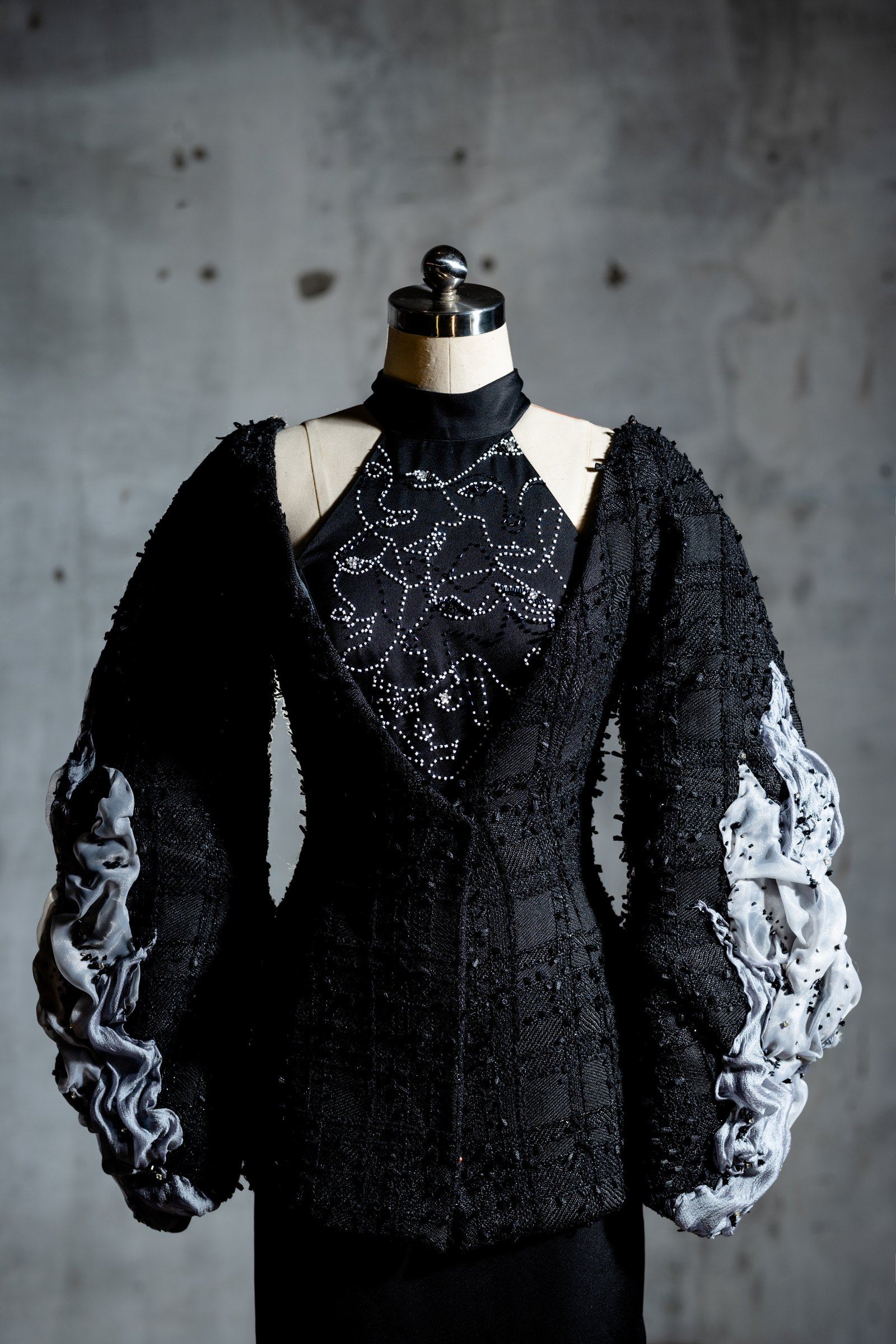 The Inner Faces jacket from the side, showing the layered sleeve